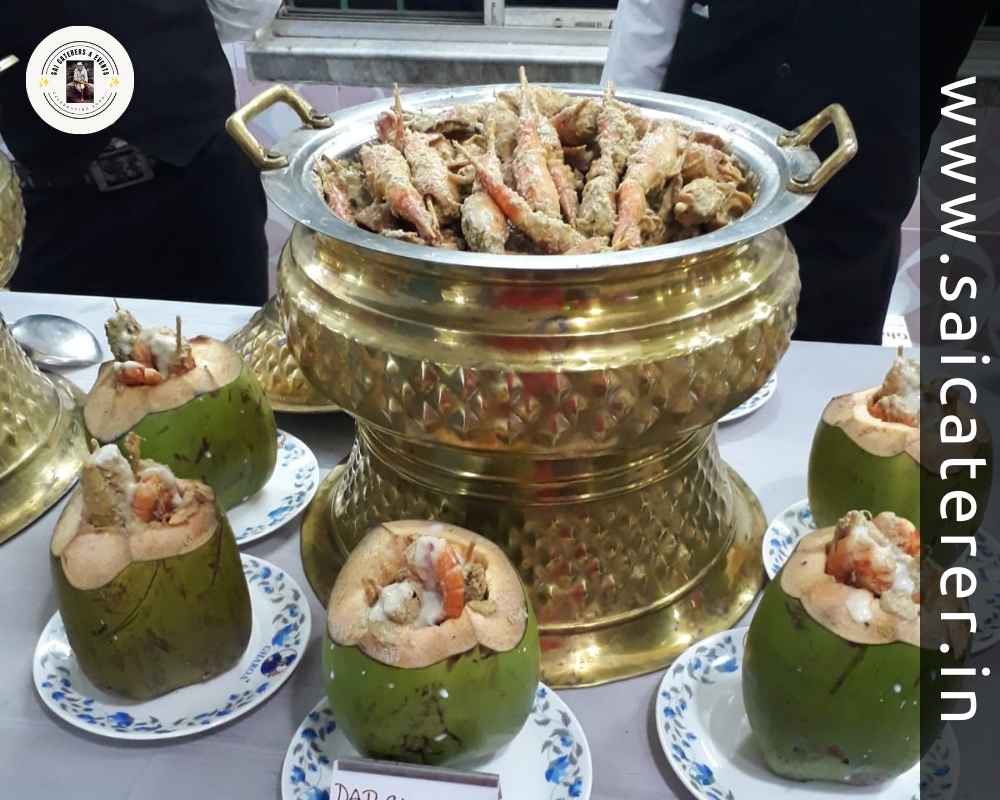 Dab Chingri served in decorated Bengali wedding buffet