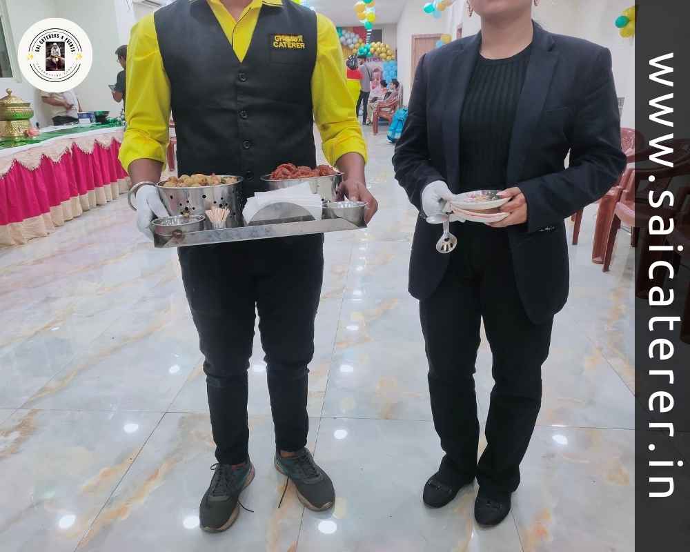 Live wedding catering staff serving chicken pakora and paneer tikka