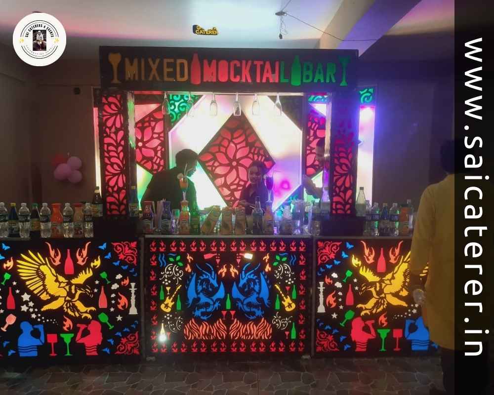 Mixed mocktail counter with glasses and lighting at wedding
