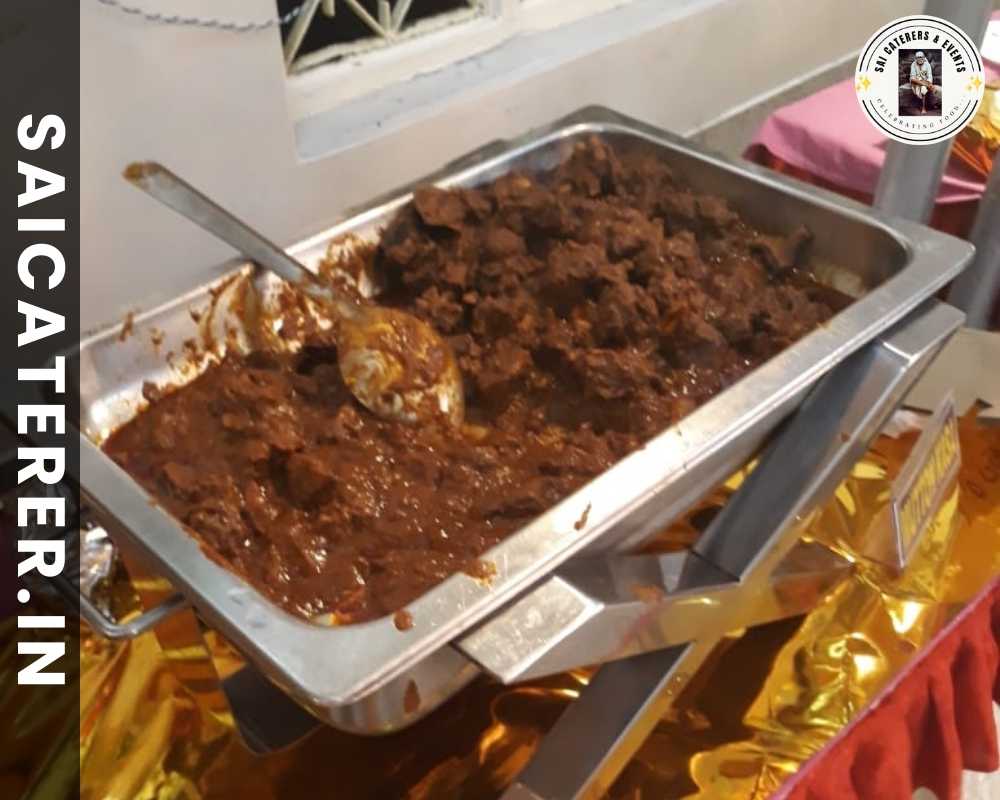 Guests being served mutton curry at buffet counter