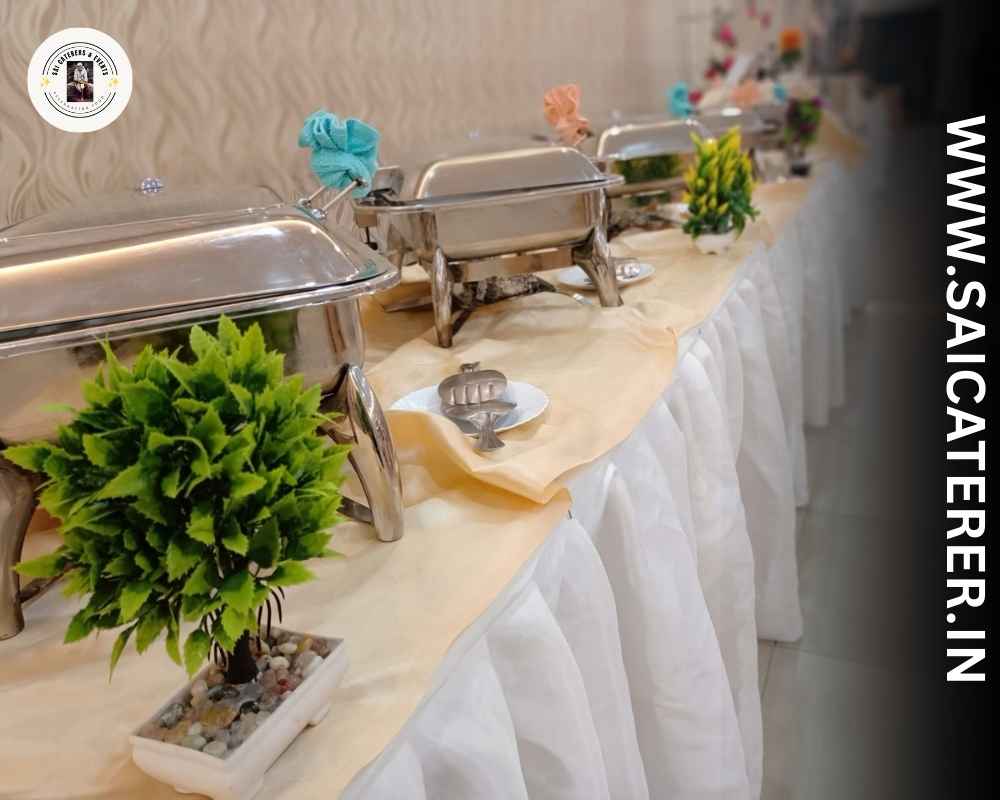 Fresh buffet counter with plants and Bengali veg dishes