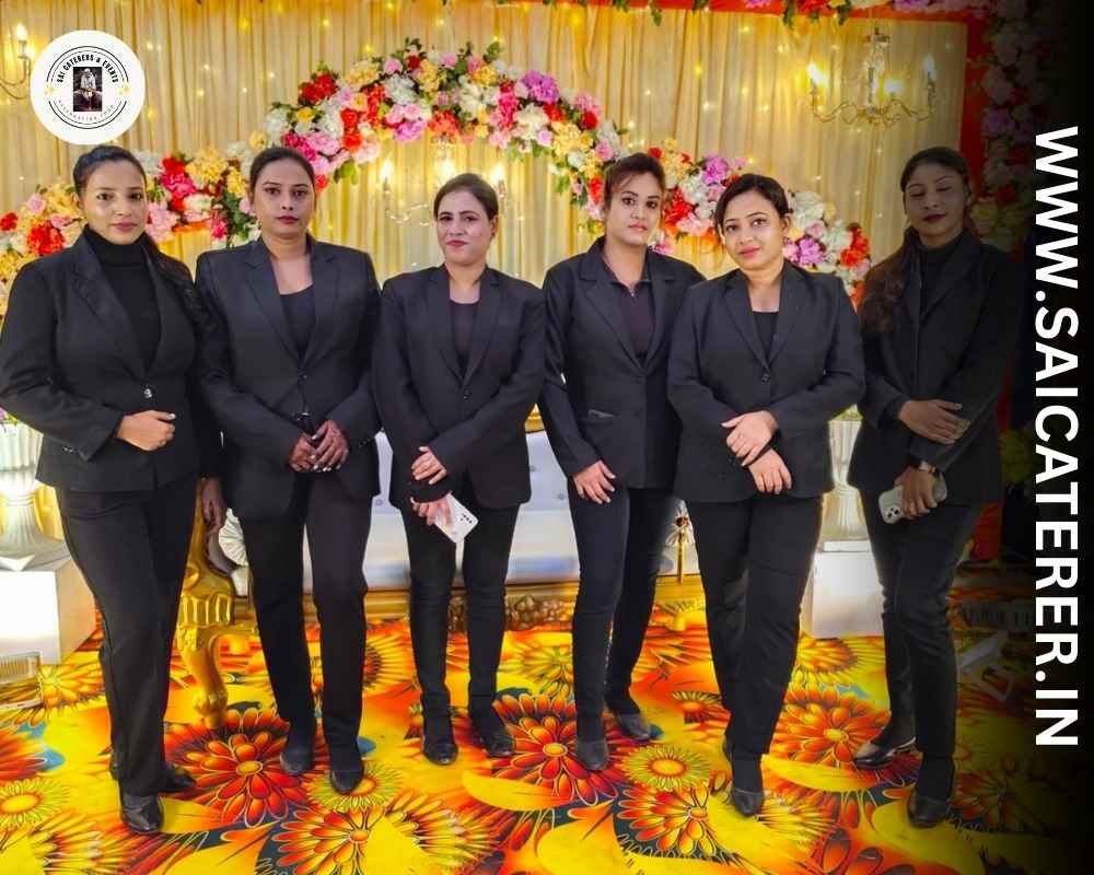Female staff in uniform at Bengali wedding catering in Sealdah