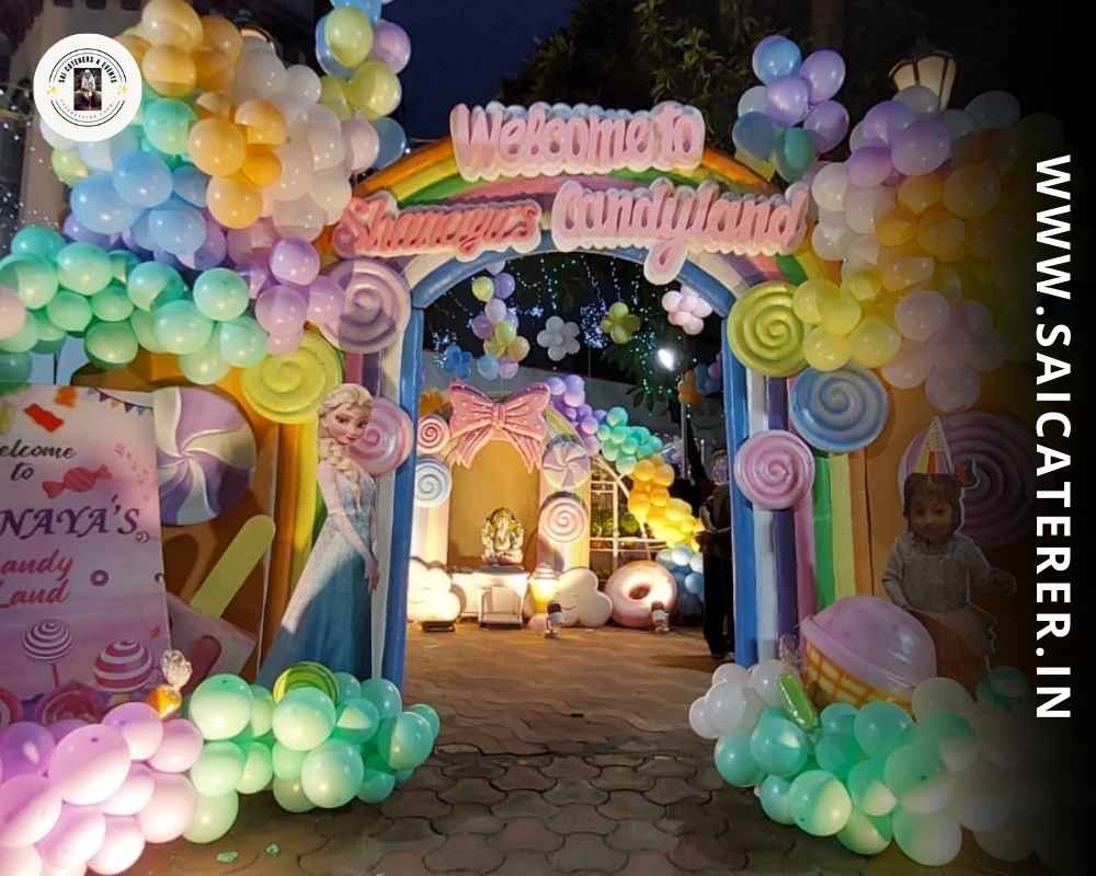Theme-based birthday catering Candyland decor with balloon gate