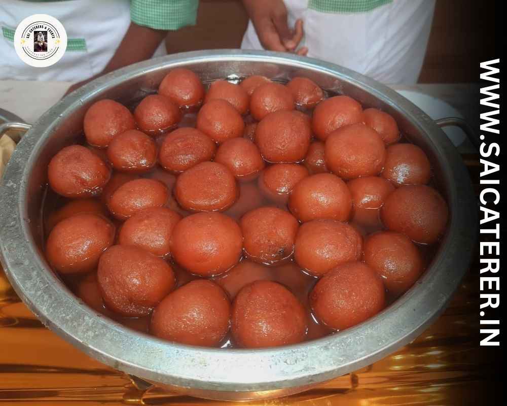 Traditional Bengali sweet pantua served in catering buffet