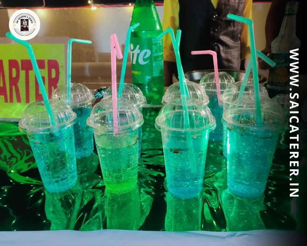 Annaprashan catering juice counter with colorful drinks and straws