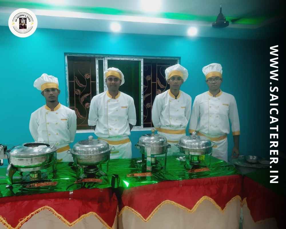 Staff in white uniform at annaprashan catering counter in North Kolkata
