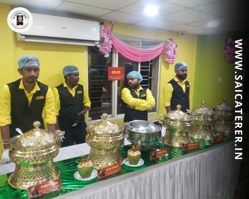Catering staff with hair cover and gloves at indoor AC venue in Kolkata