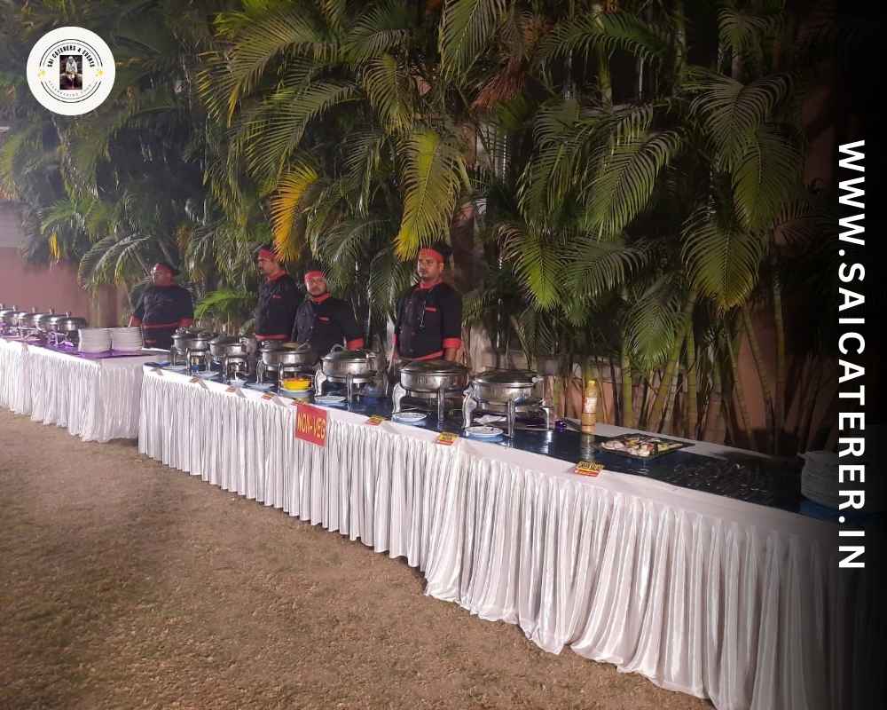 Corporate catering service with staff serving food in Sonarpur garden