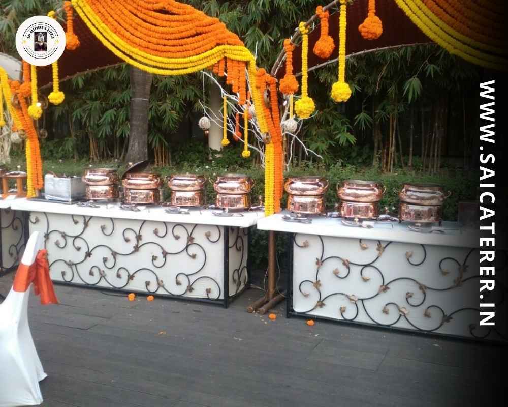 Outdoor small party catering buffet setup with flowers in Dum Dum