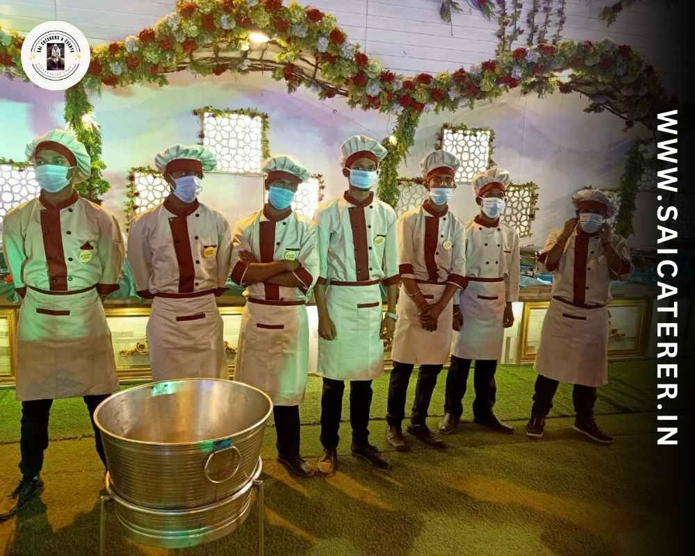 Outdoor caterers in Kolkata lined up with gloves, masks, and hair cover