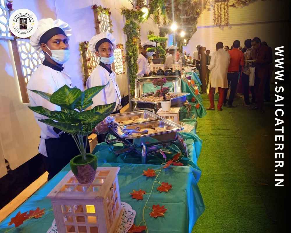 Outdoor catering buffet with rice, dal, paneer served by staff in Lake Town Kolkata