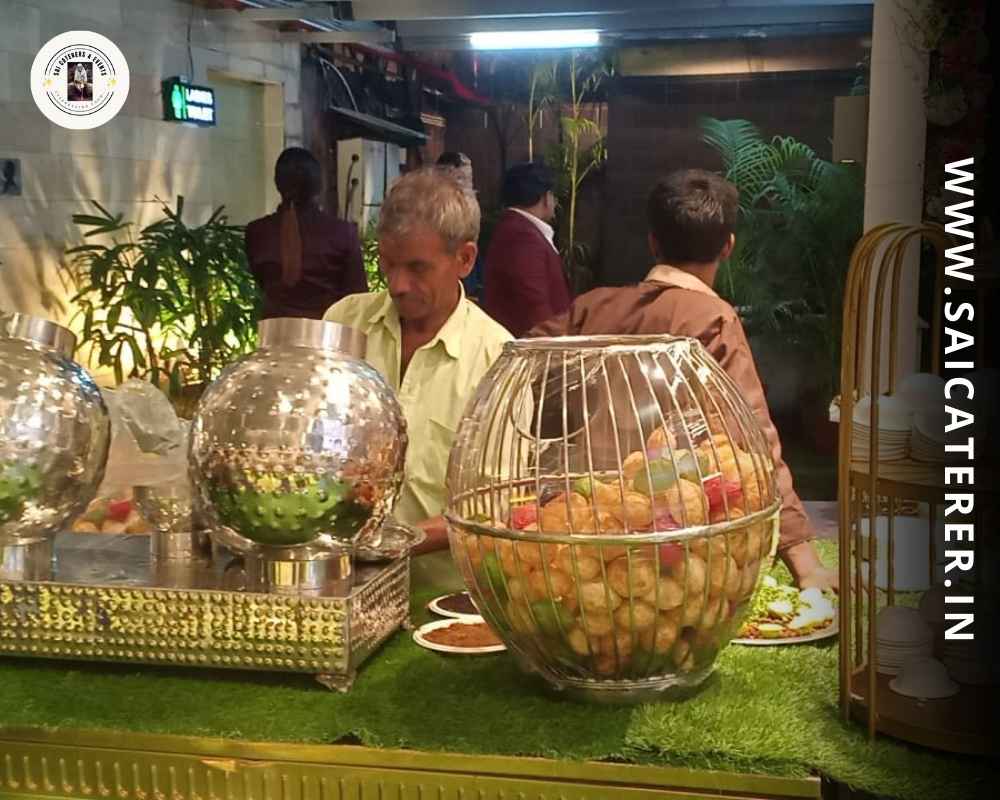 Professional serving phuchka at birthday catering event counter