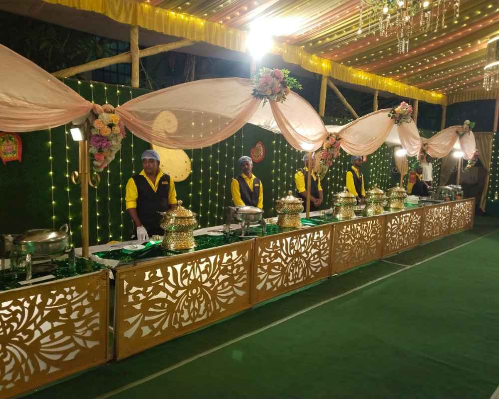 Reception catering buffet with lighting and hygienic staff in Baranagar