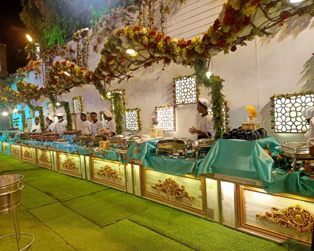 Reception catering live counter setup with staff at PC Chandra Garden