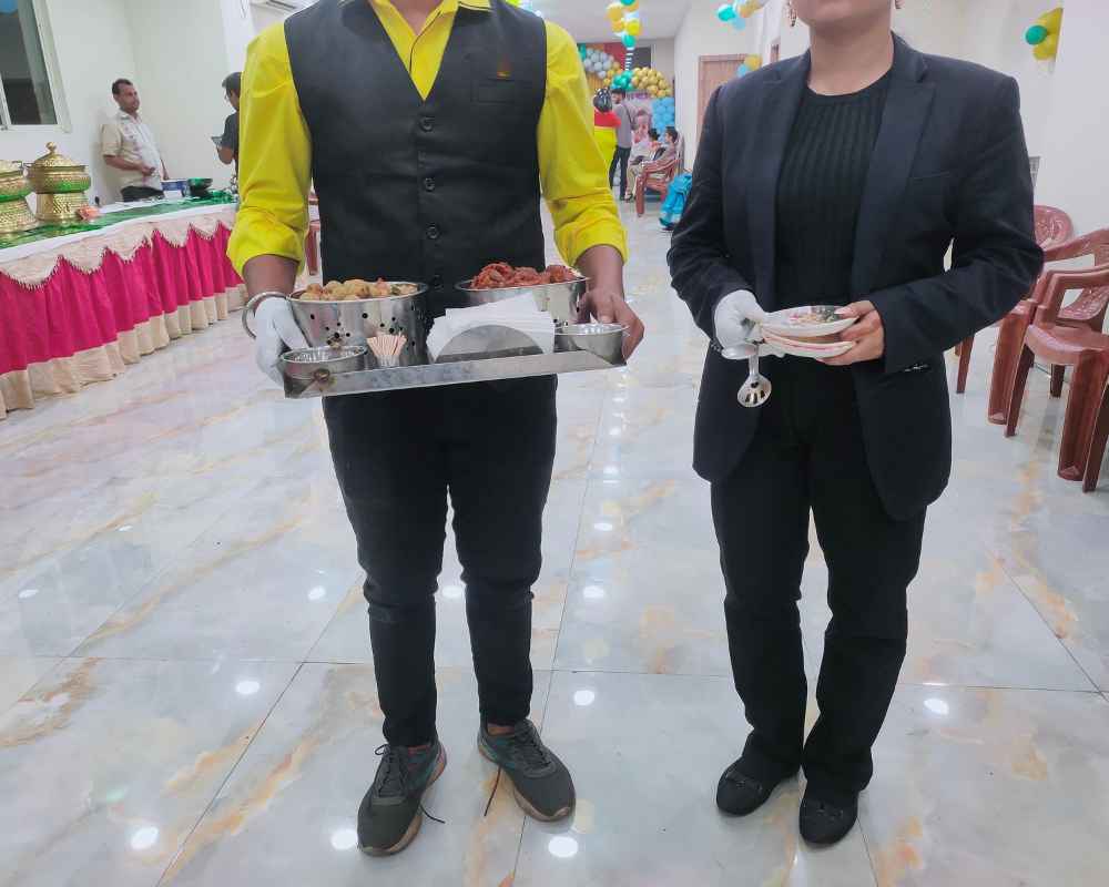 Catering girls serving starters at wedding reception in Kolkata