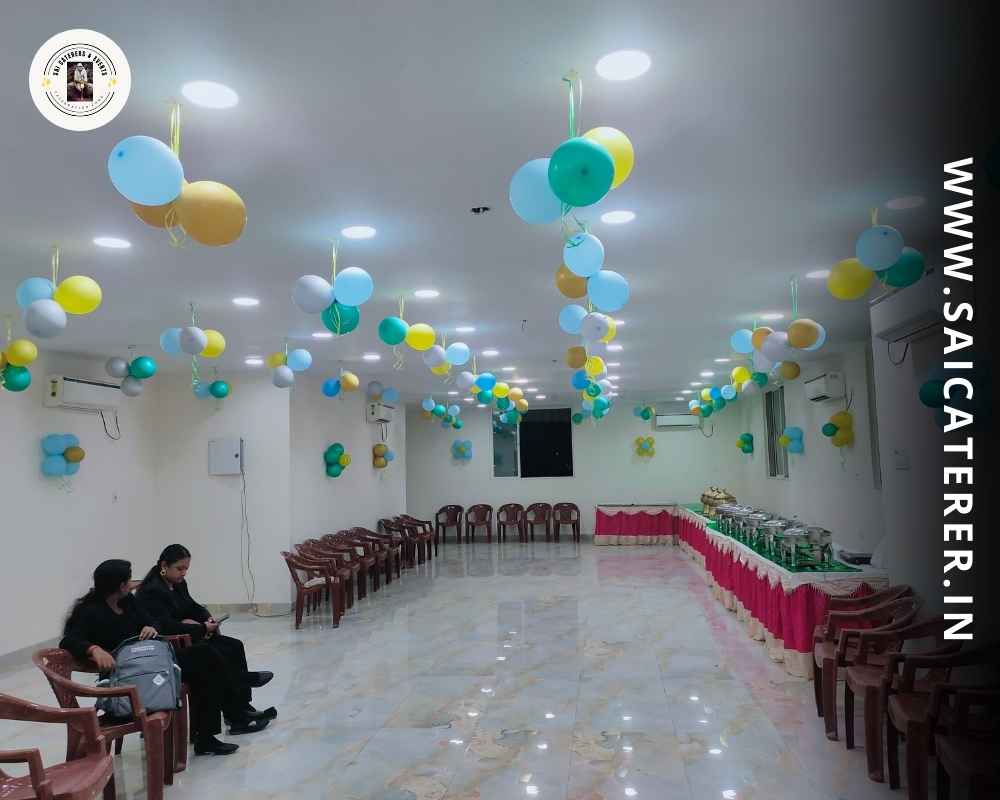 Annaprashan catering venue with balloon décor and buffet counters